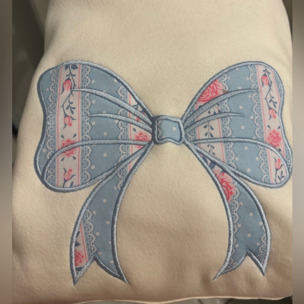 NWOT Altar’d State Cream Sweatshirt with Blue and Pink Bow